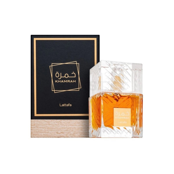 Perfume bottle with Khamrah branding next to a black box with the brand name.
