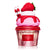Fragrance bottle designed like a strawberry shortcake with a red lid, pink body, and strawberry on top.
