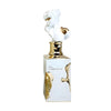 Perfume bottle with artistic design on a white background